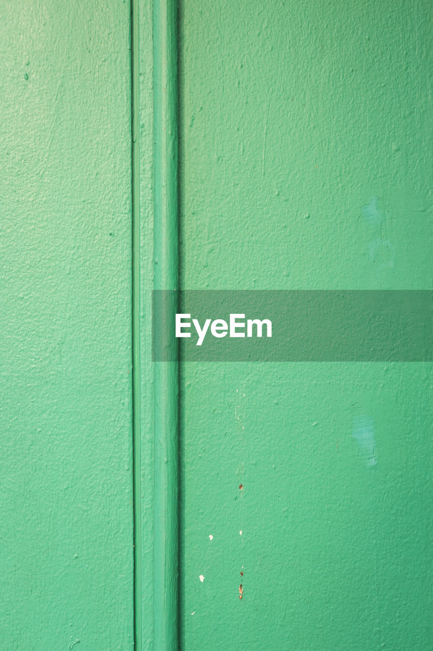 green, backgrounds, full frame, textured, wall - building feature, no people, built structure, pattern, line, architecture, close-up, wall, floor, day, yellow, rough, building exterior, wood, circle, metal, outdoors, door, old, weathered