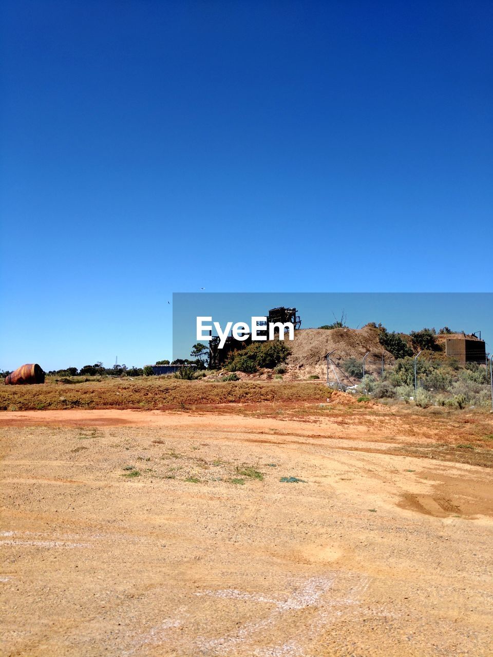 SCENIC VIEW OF SAND AGAINST CLEAR BLUE SKY AGAINST THE BACKGROUND
