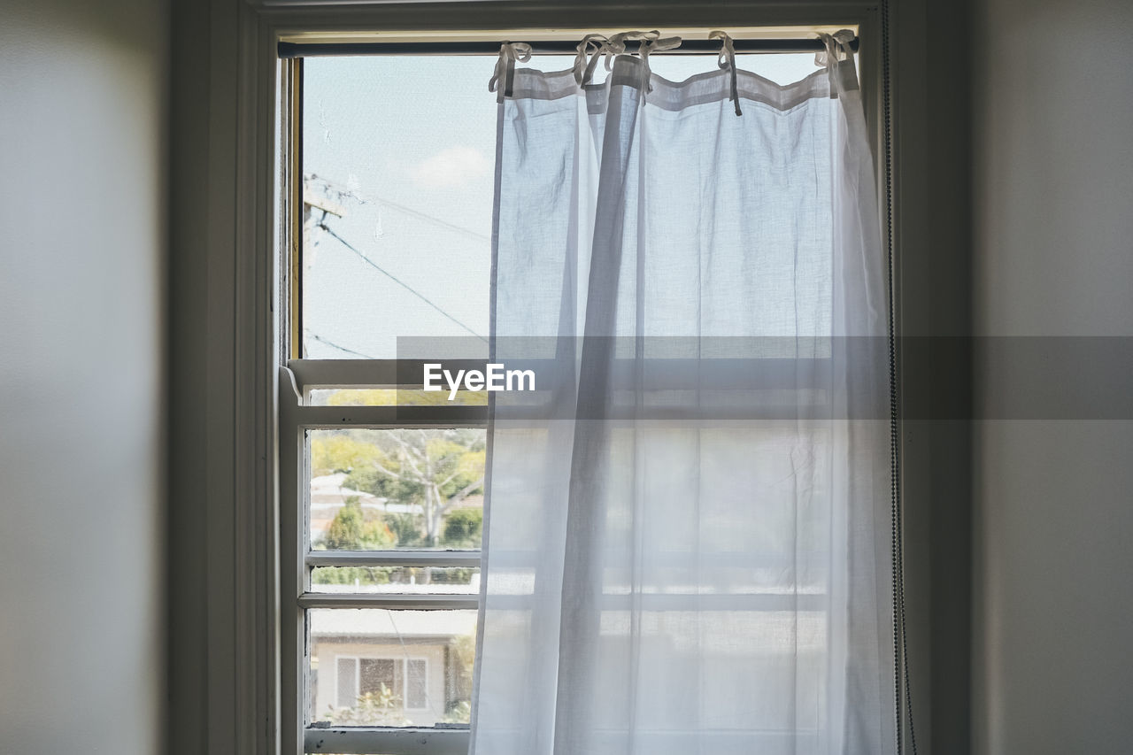 window, curtain, window treatment, window covering, indoors, interior design, no people, glass, day, transparent, home interior, room, hanging, white, textile, sash window, door, open, architecture, nature