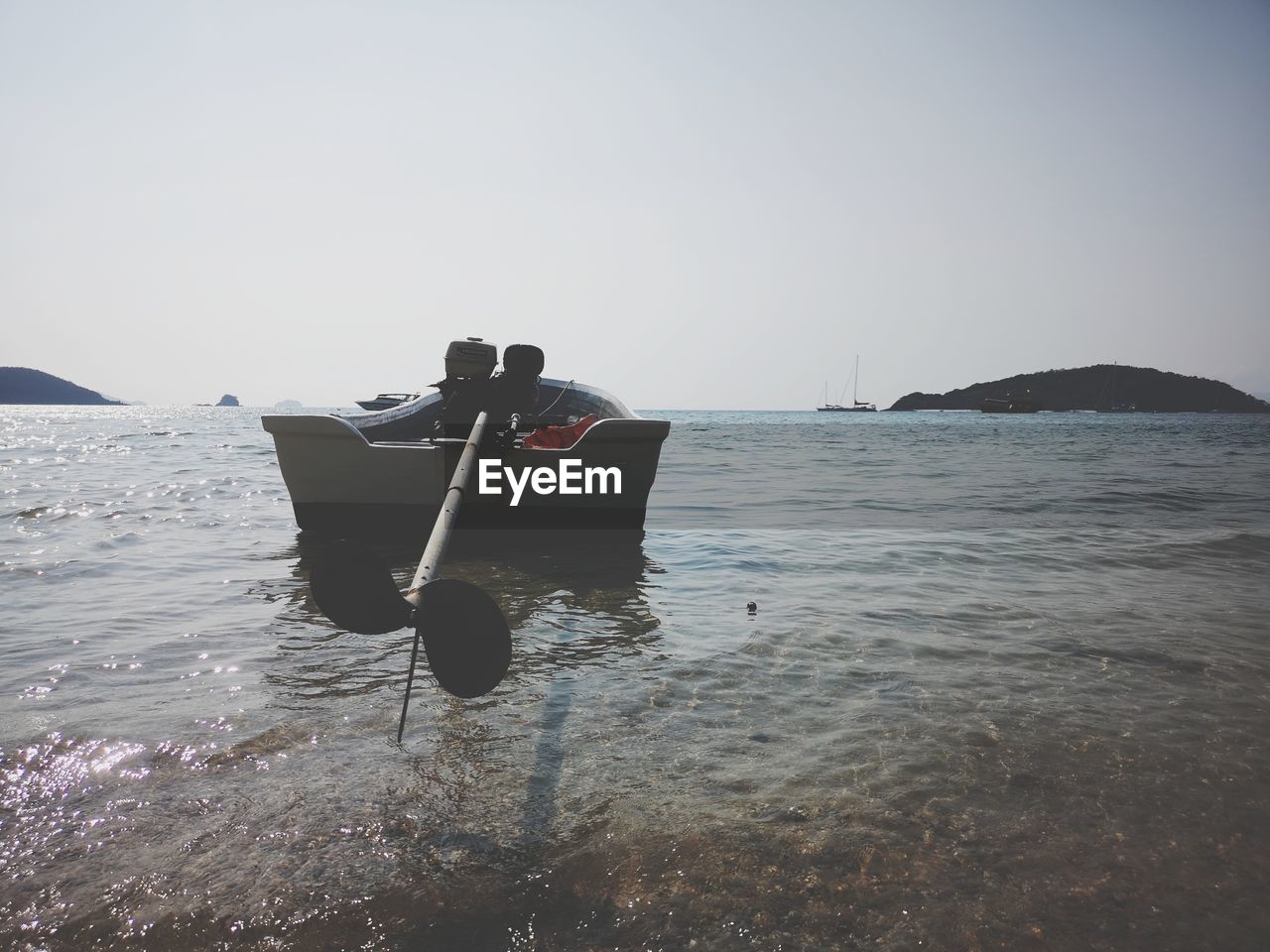 BOAT ON SEA AGAINST CLEAR SKY