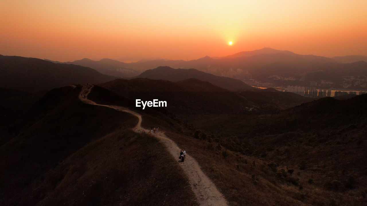 Hiking trails in wan kuk shan, ma on shan  . scenic view of mountains against sky during sunset