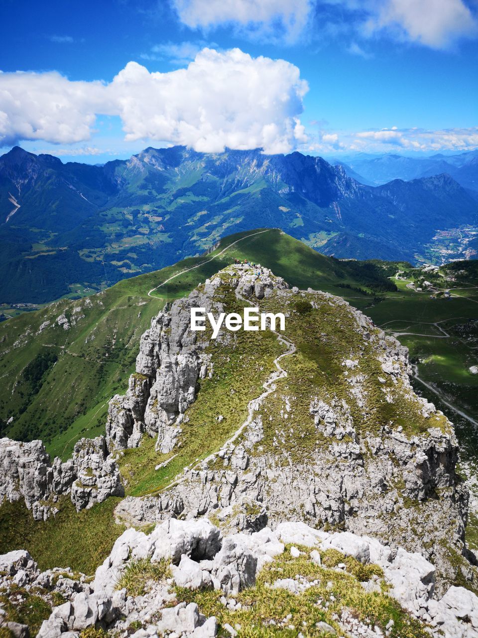 AERIAL VIEW OF SNOWCAPPED MOUNTAINS AGAINST SKY