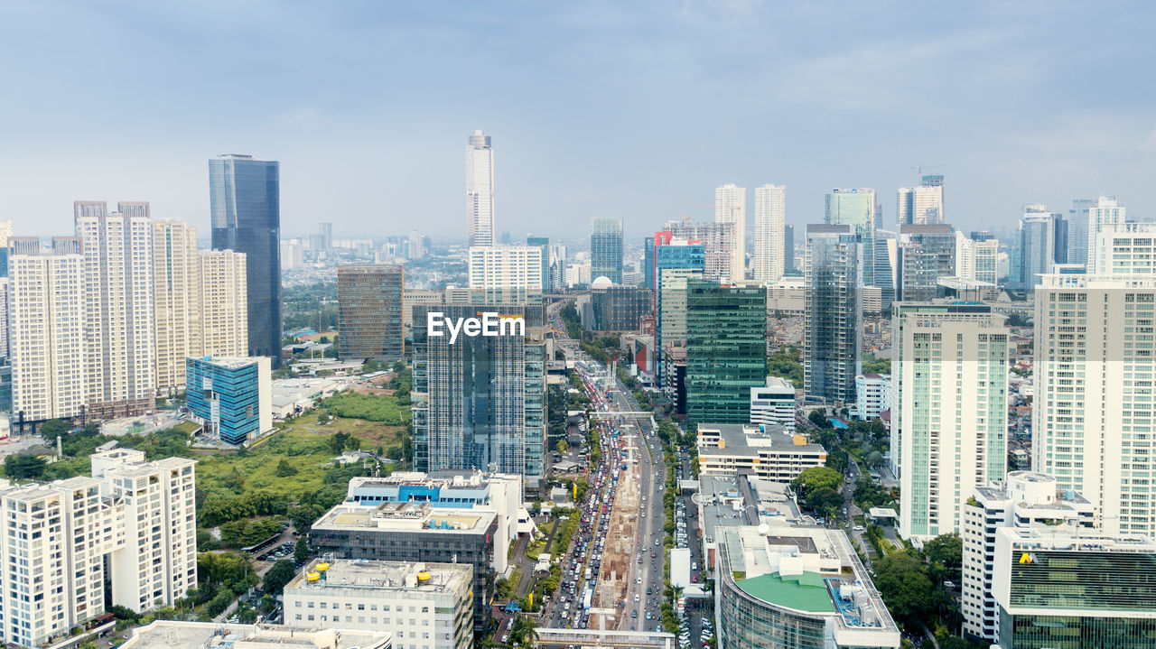 High angle view of buildings in city against sky