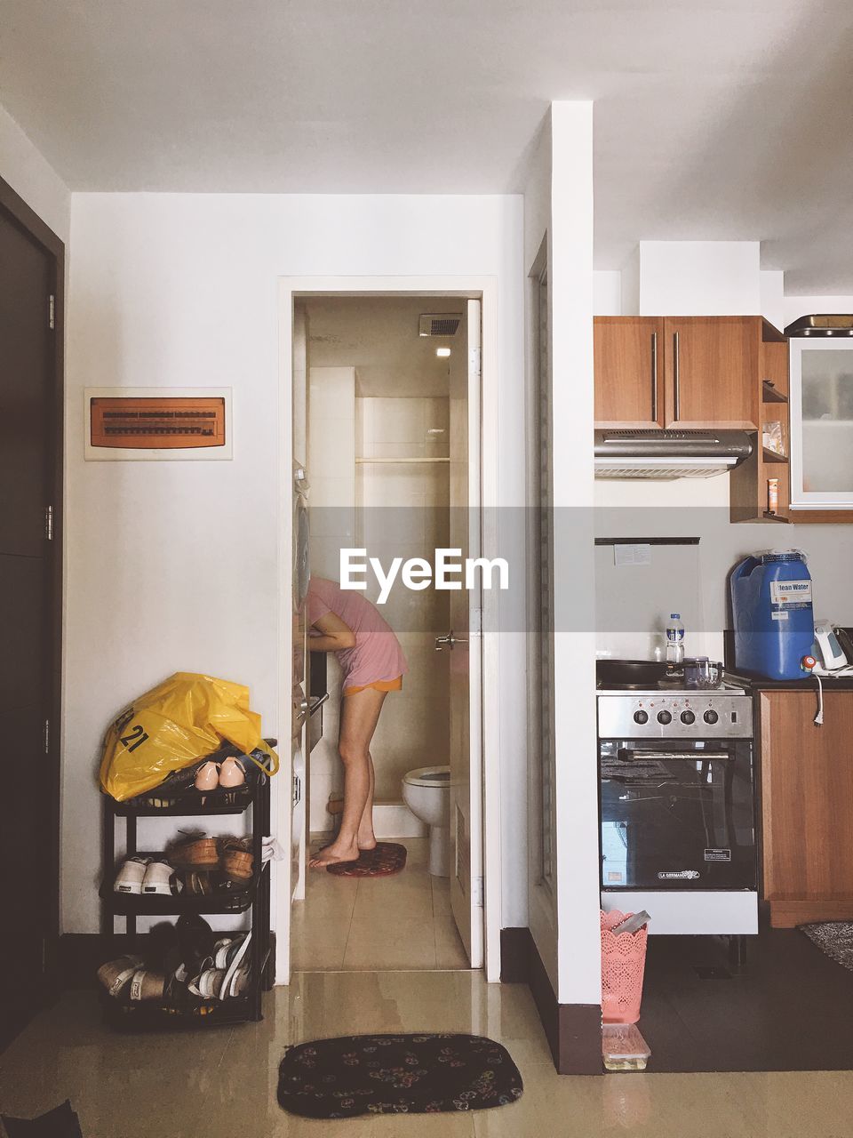 MAN WORKING IN SHELF AT HOME