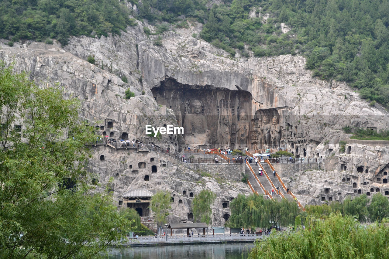 HIGH ANGLE VIEW OF TOURISTS ON ROCK FORMATION
