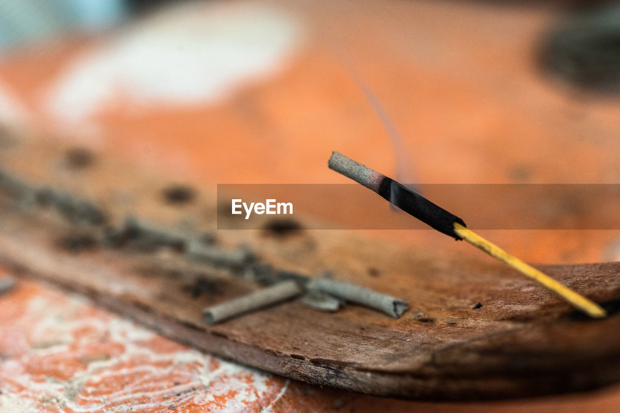 CLOSE-UP OF CIGARETTE SMOKING