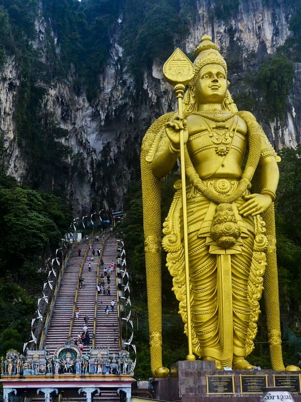 Low angle view of lord murugan statue at batu caves