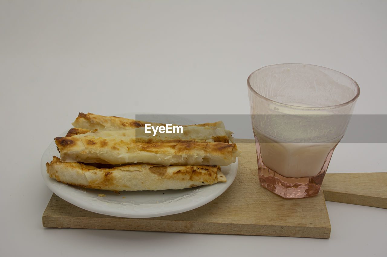 CLOSE-UP OF BREAD AND COFFEE ON TABLE