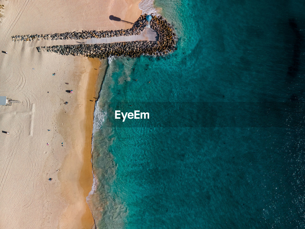 HIGH ANGLE VIEW OF POOL ON BEACH