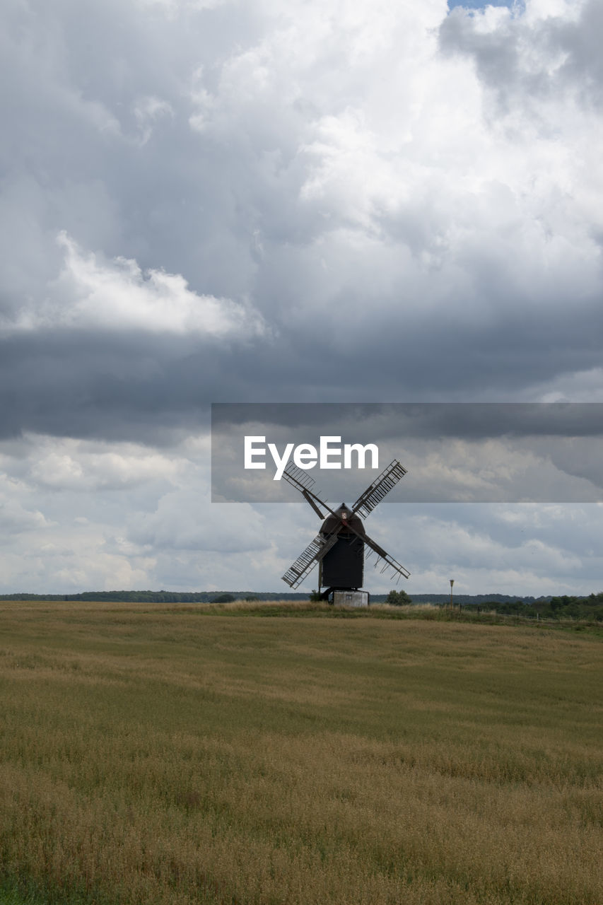 low angle view of windmill against sky