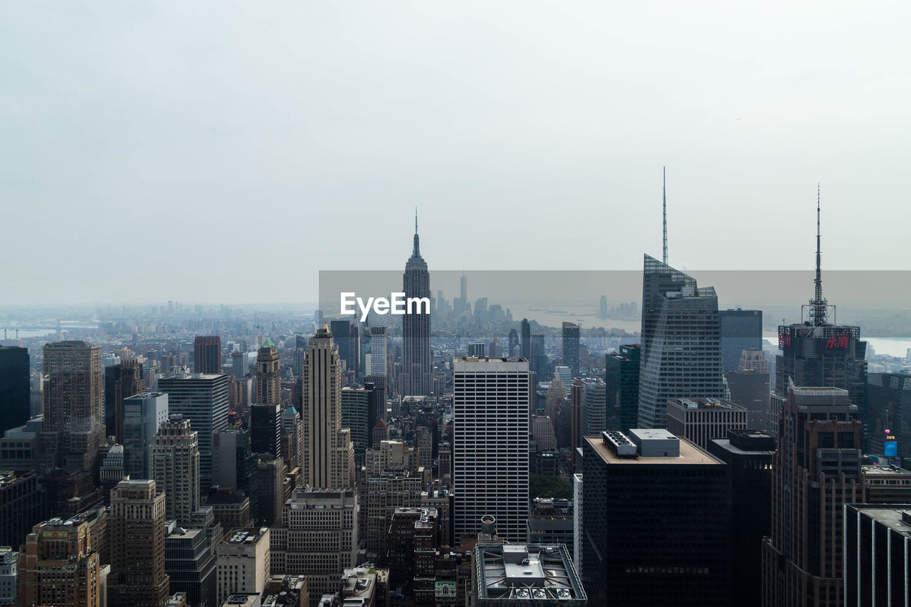 Modern buildings in city against sky