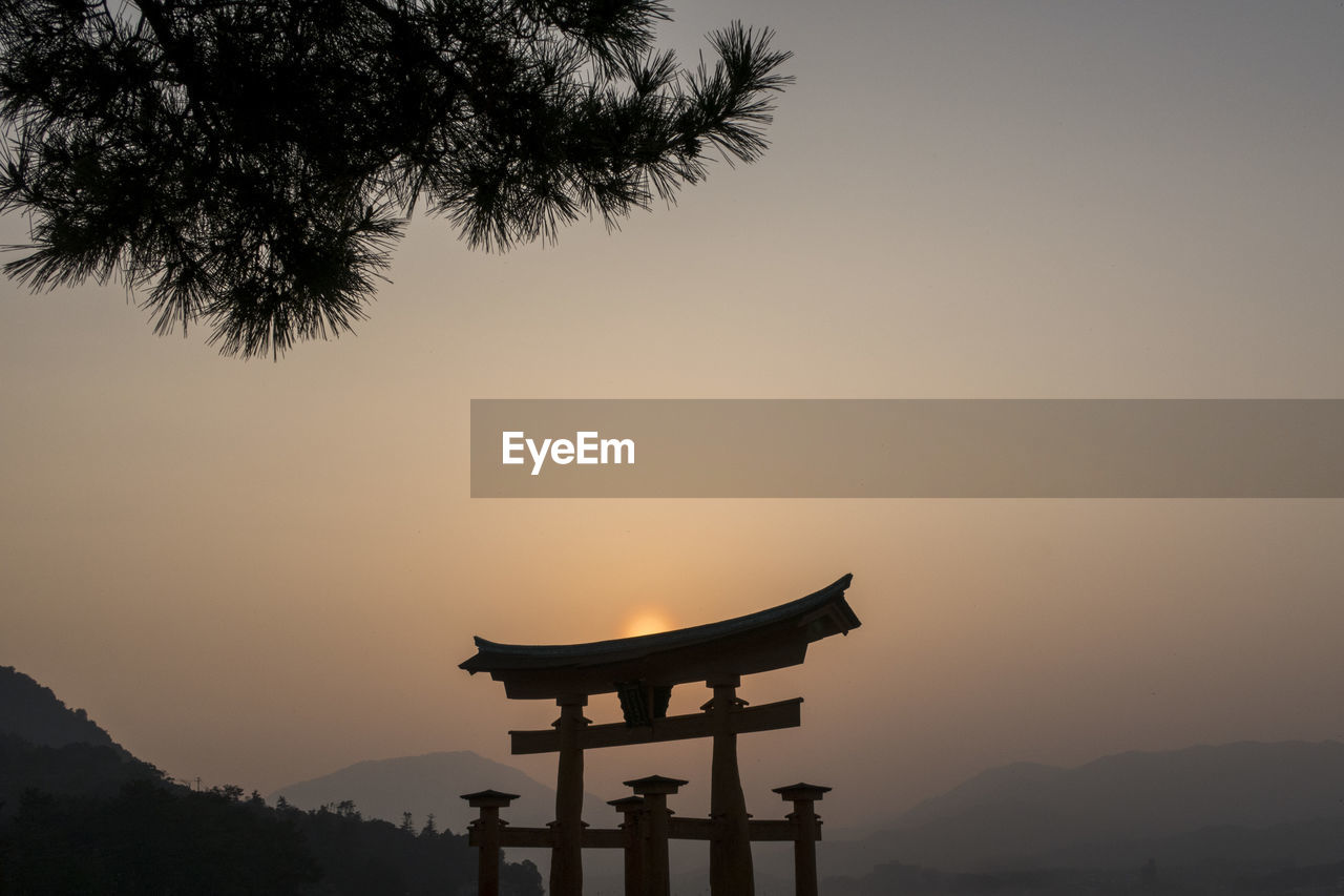 SILHOUETTE OF TEMPLE AGAINST SKY