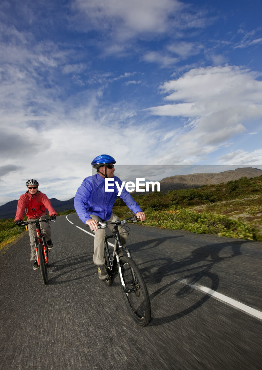 Two friends riding their mountain bikes around lake thingvellir