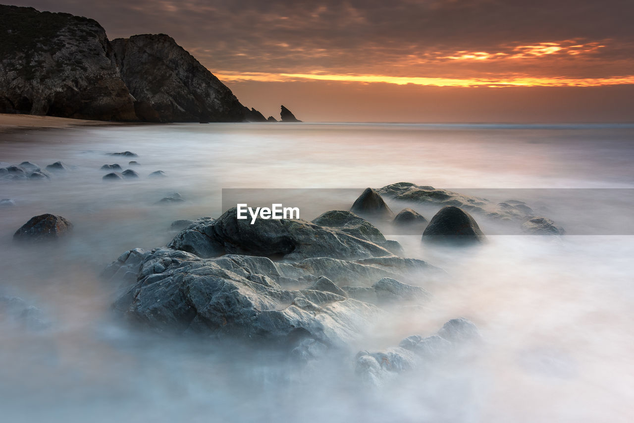 Scenic view of sea against sky during sunset