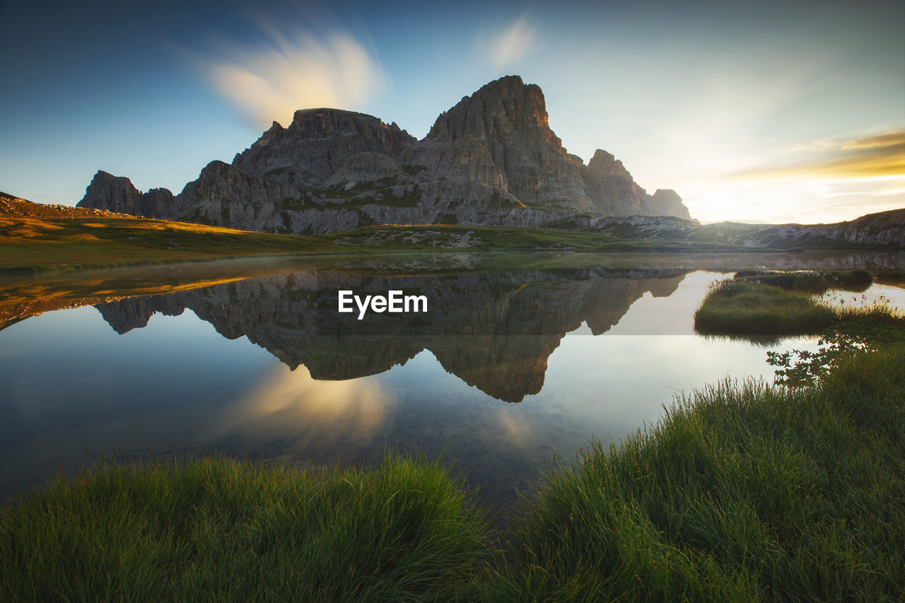 Scenic view of lake and mountains against sky