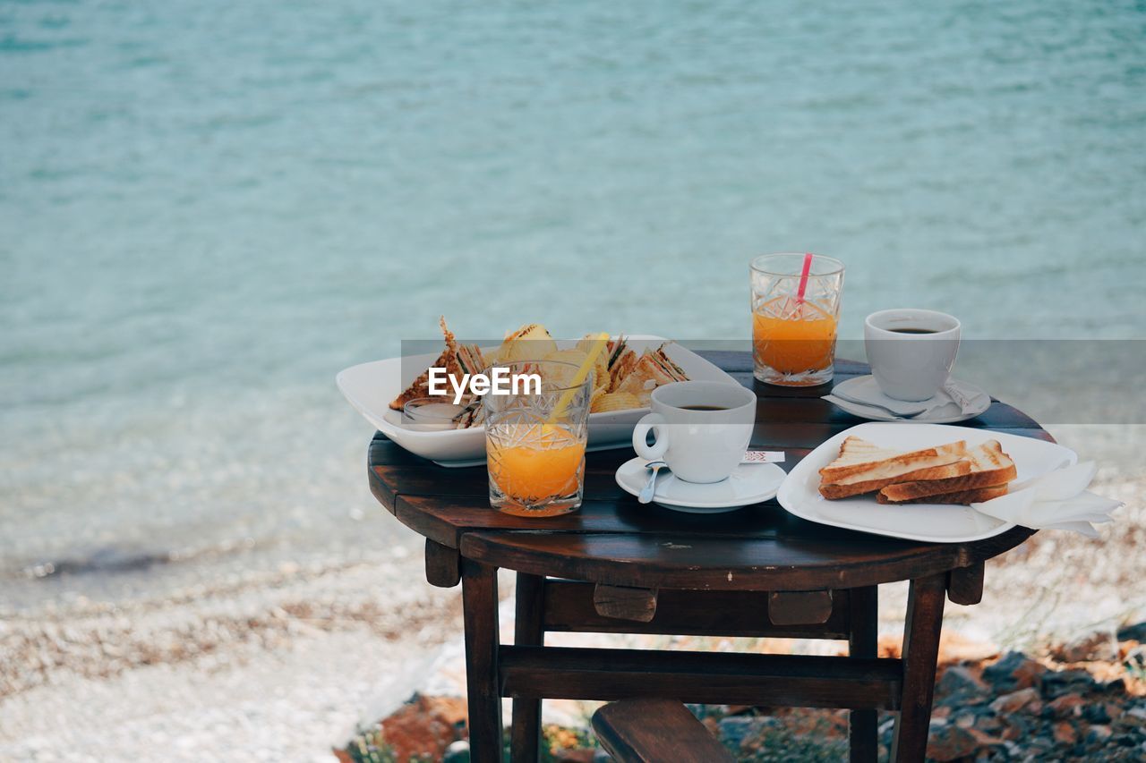 Place setting on table by sea