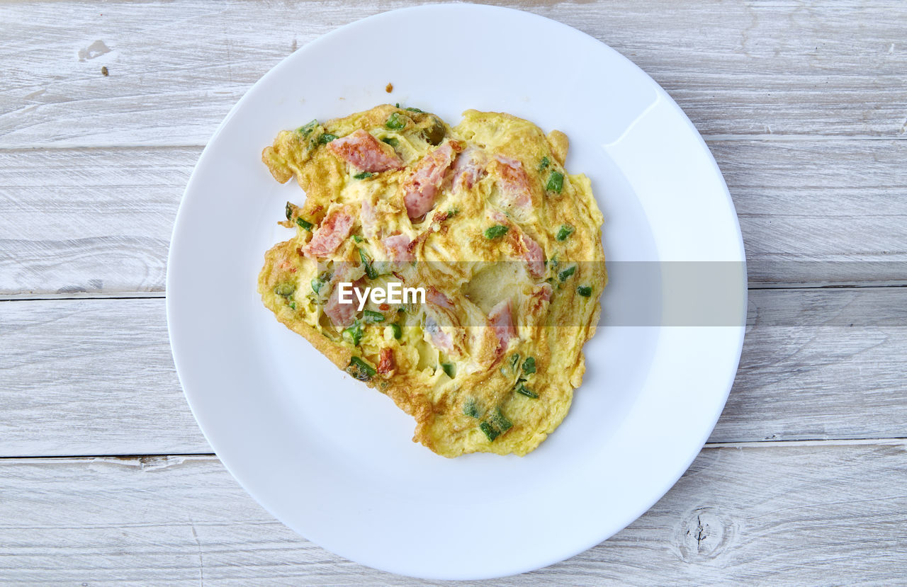 Directly above shot of omelet served in plate on table