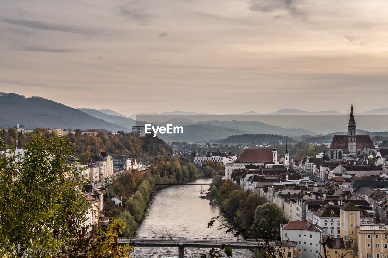 High angle view of townscape and mountains against sky