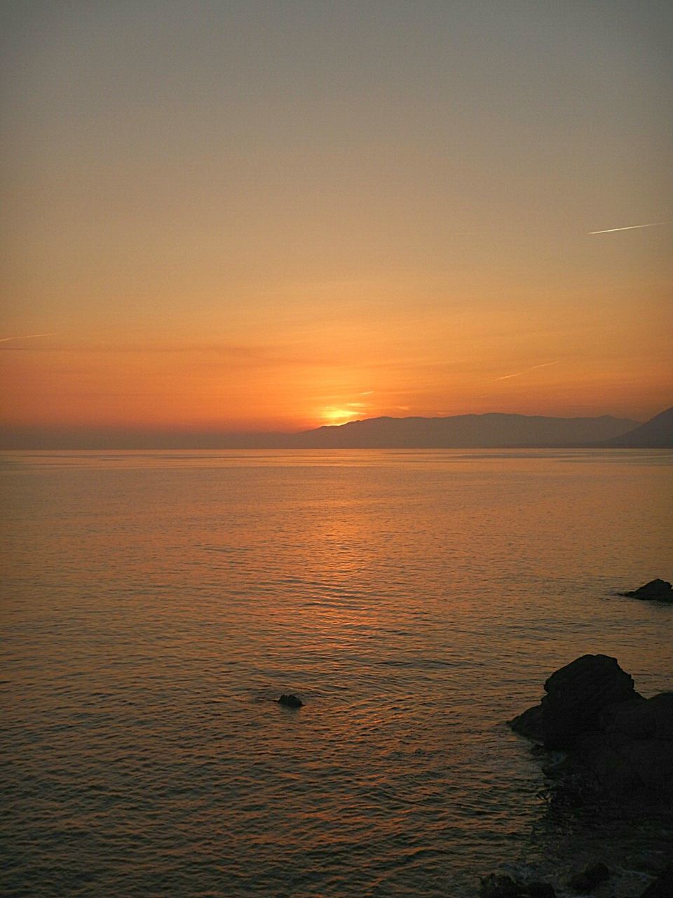 SCENIC VIEW OF SEA AT SUNSET