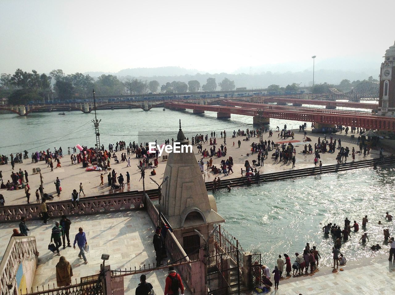 High angle view of people at temple and ganges river bank