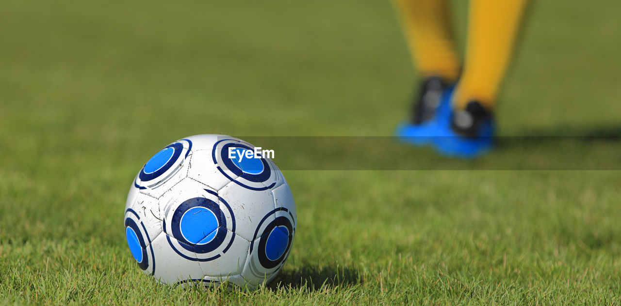 Close-up of soccer ball on grass