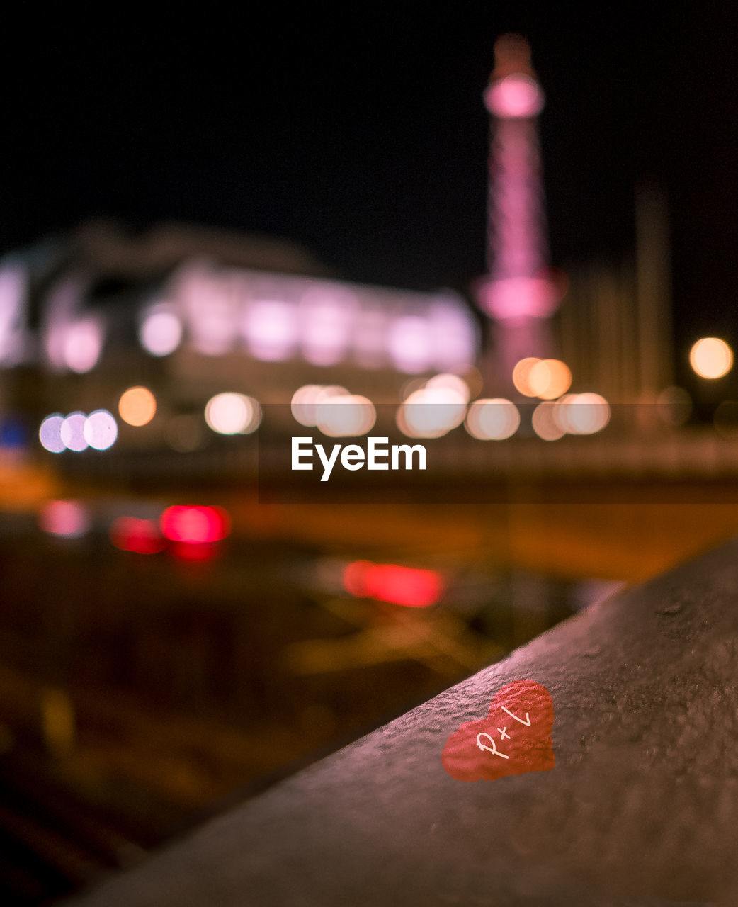 Close-up of illuminated railing at night