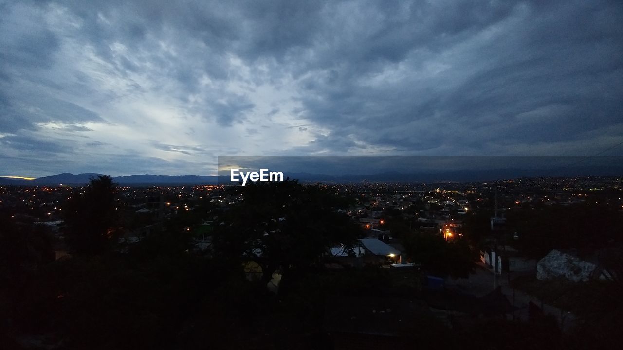 ILLUMINATED CITYSCAPE AT NIGHT