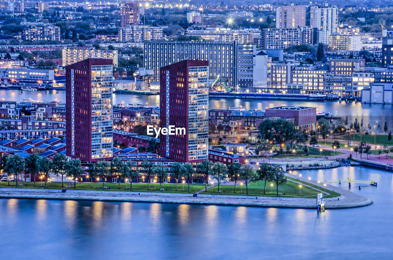 Aerial view of illuminated buildings in rotterdam at night