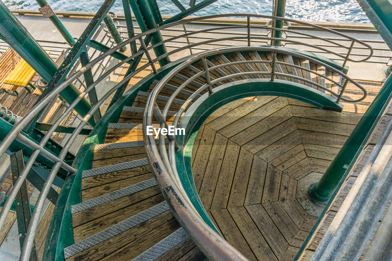 Looking down on curving stairs.