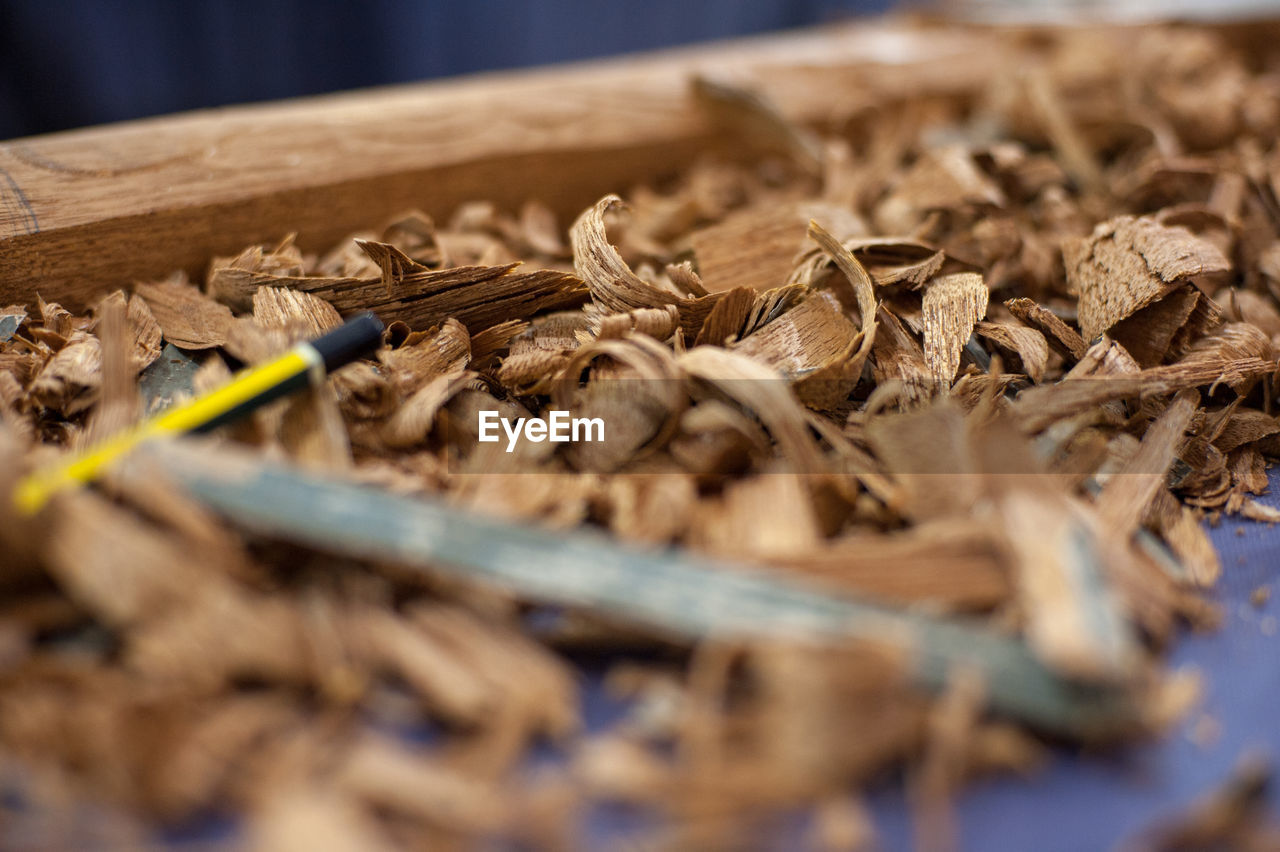 Close-up of wood shavings on table