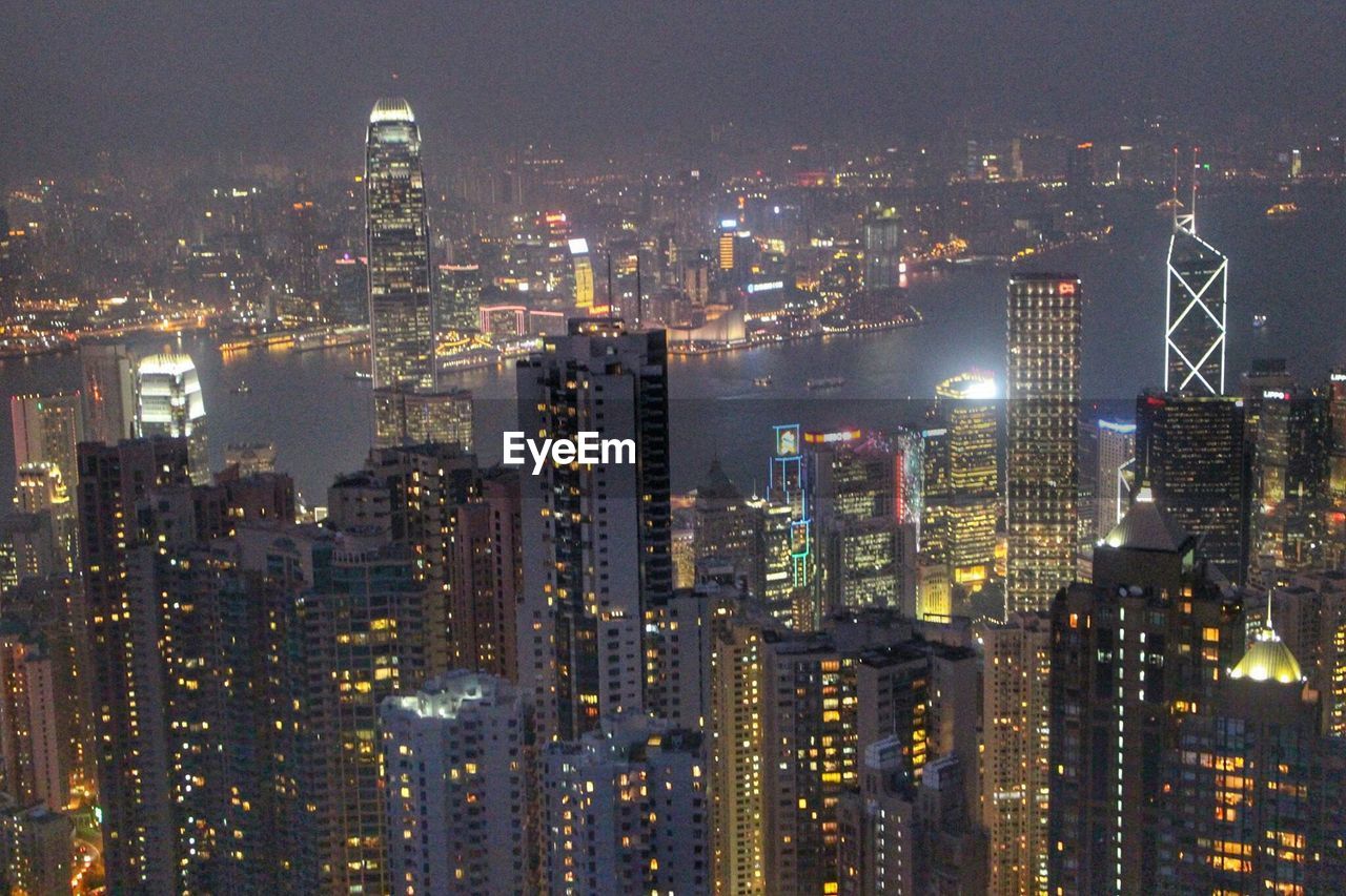 Illuminated victoria harbour at night