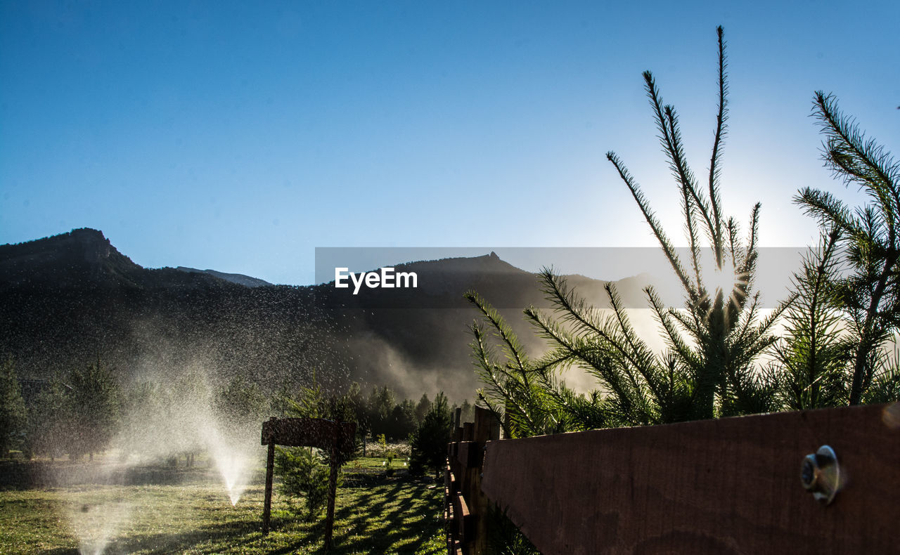 SCENIC VIEW OF MOUNTAINS AGAINST BLUE SKY