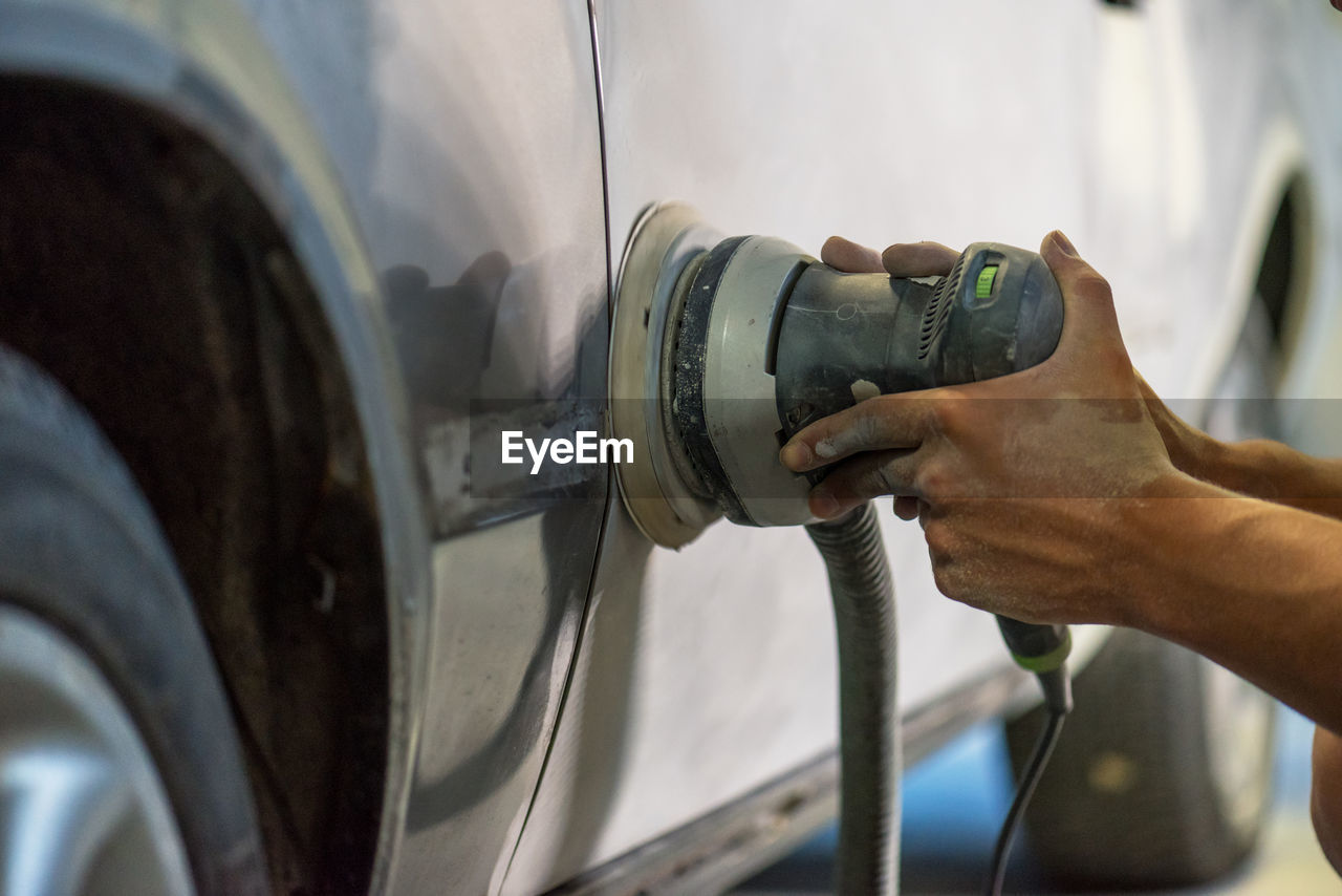 Mechanic working in auto shop.