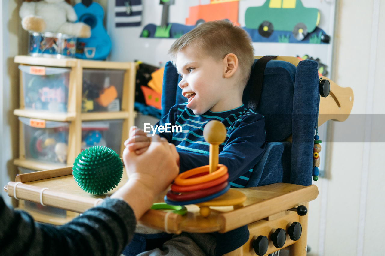 Cute boy playing with toy
