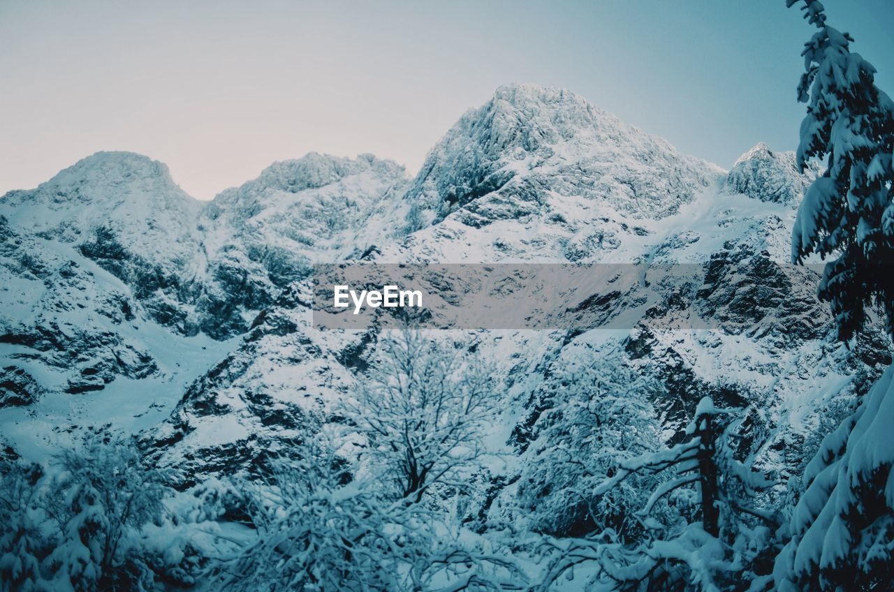 Scenic view of snowcapped mountains against sky