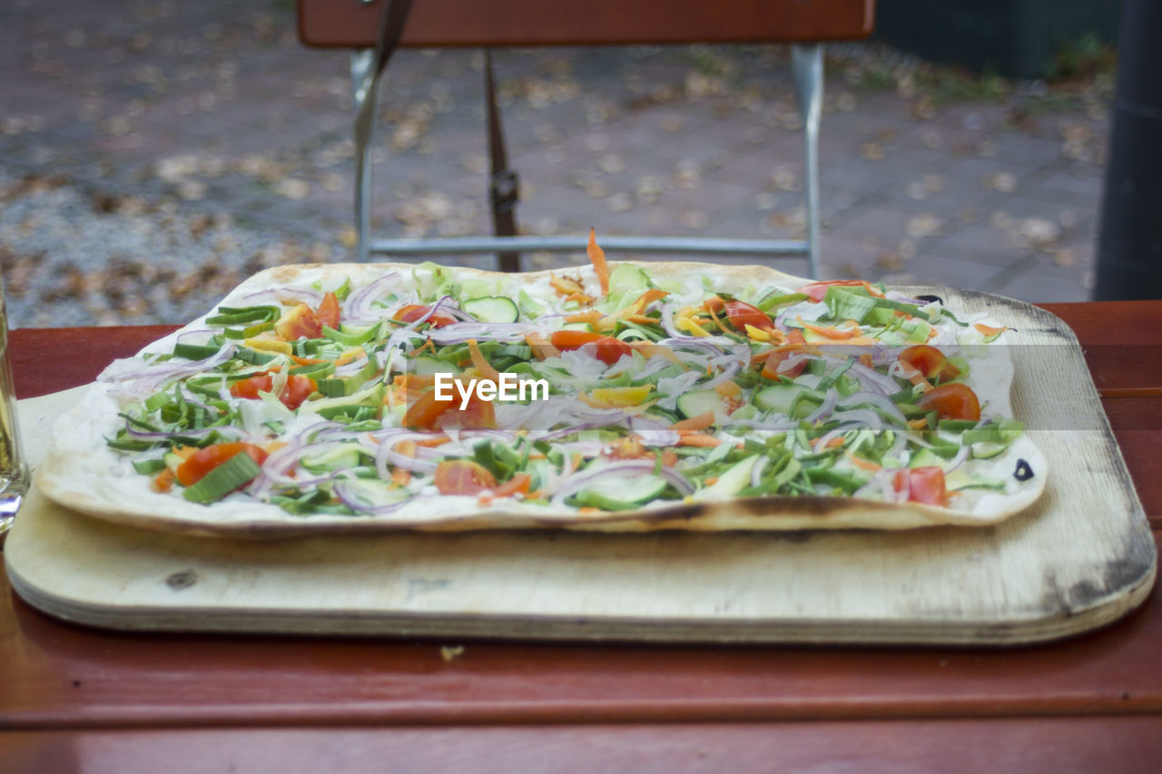 CLOSE-UP OF SALAD ON TABLE