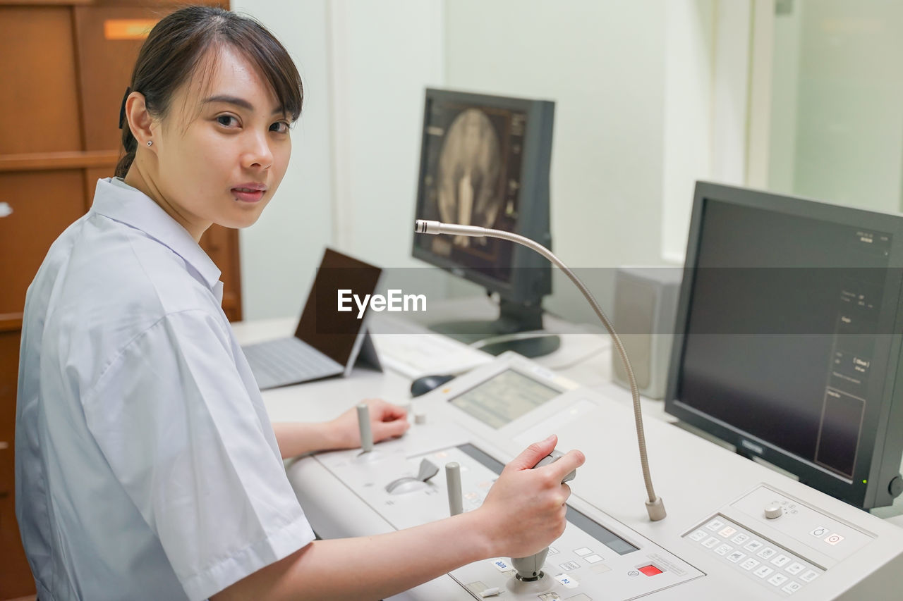 Portrait of doctor sitting in hospital