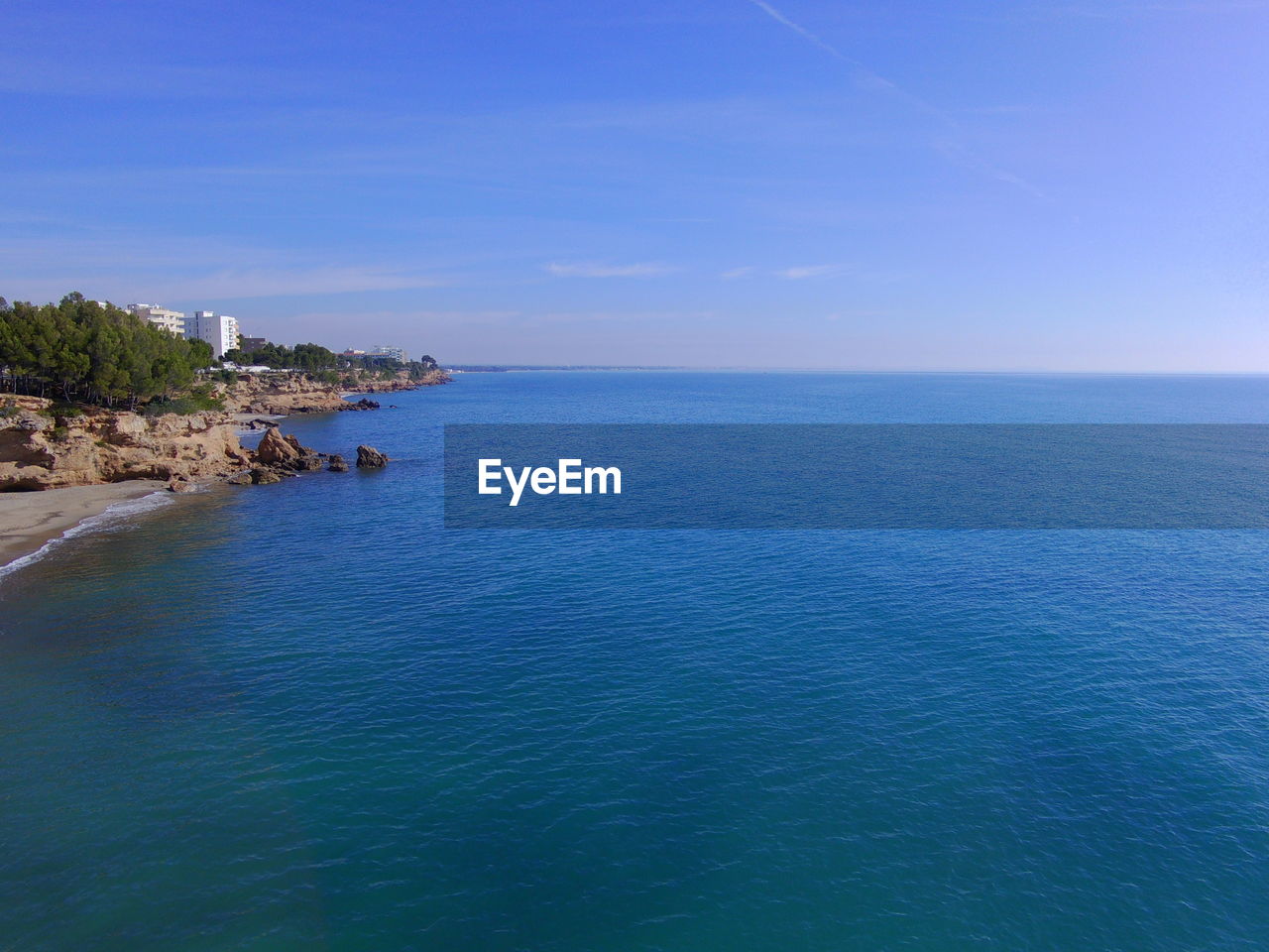 VIEW OF SEA AGAINST BLUE SKY