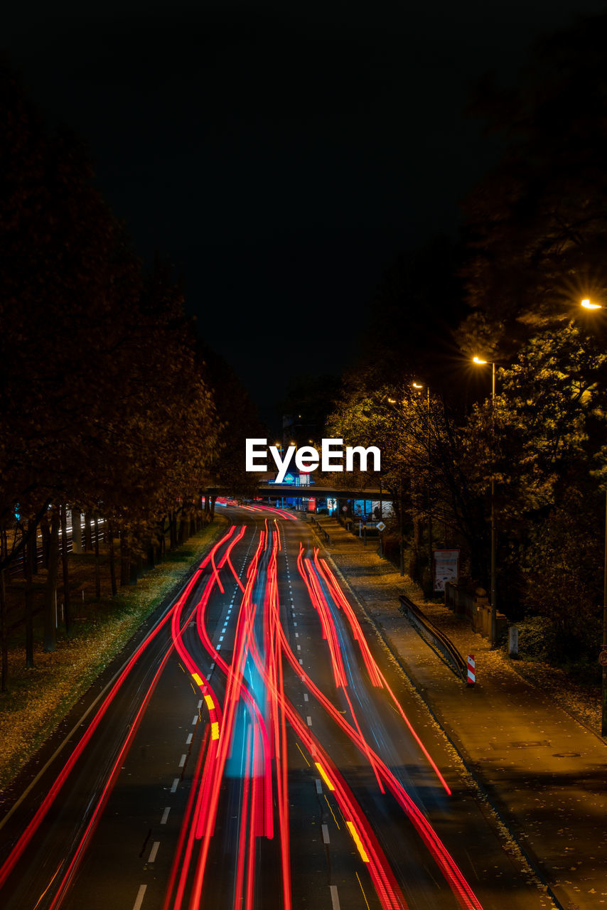 Light trails on street in city at night