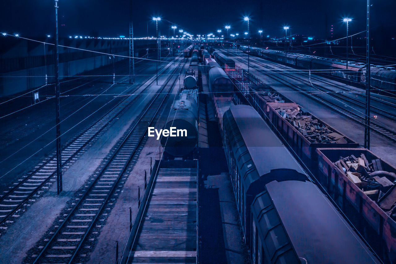 High angle view of freight train at night