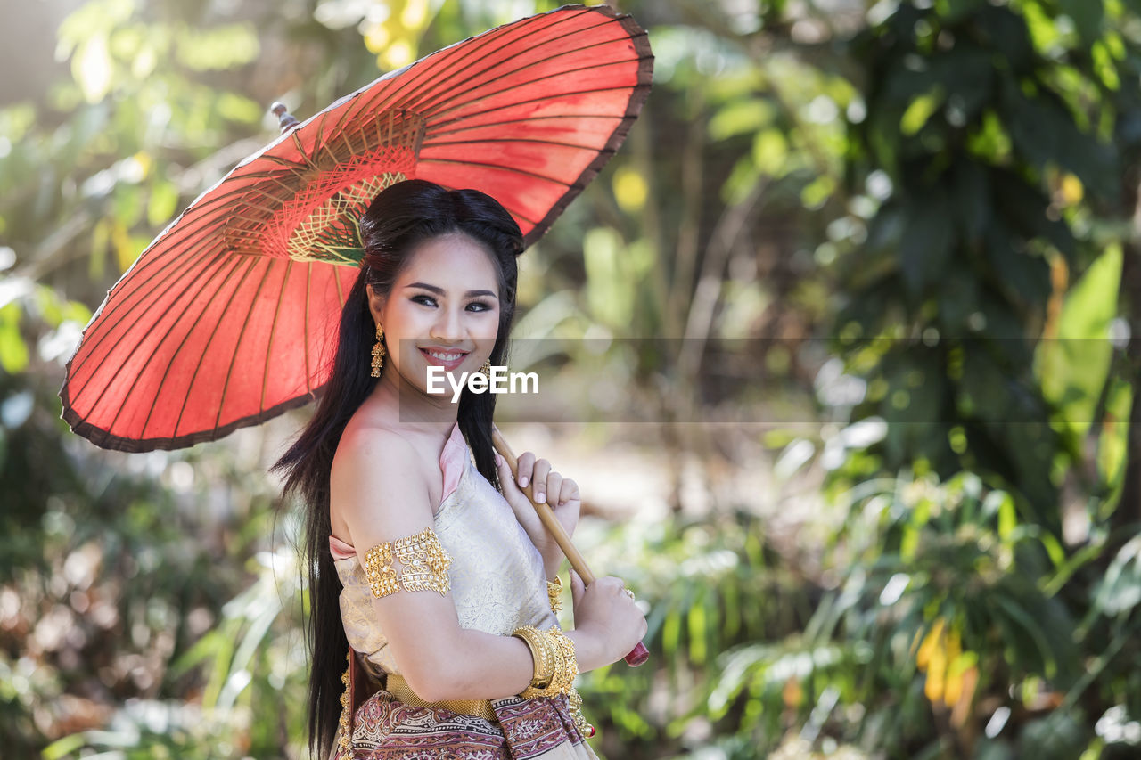 portrait of young woman with umbrella