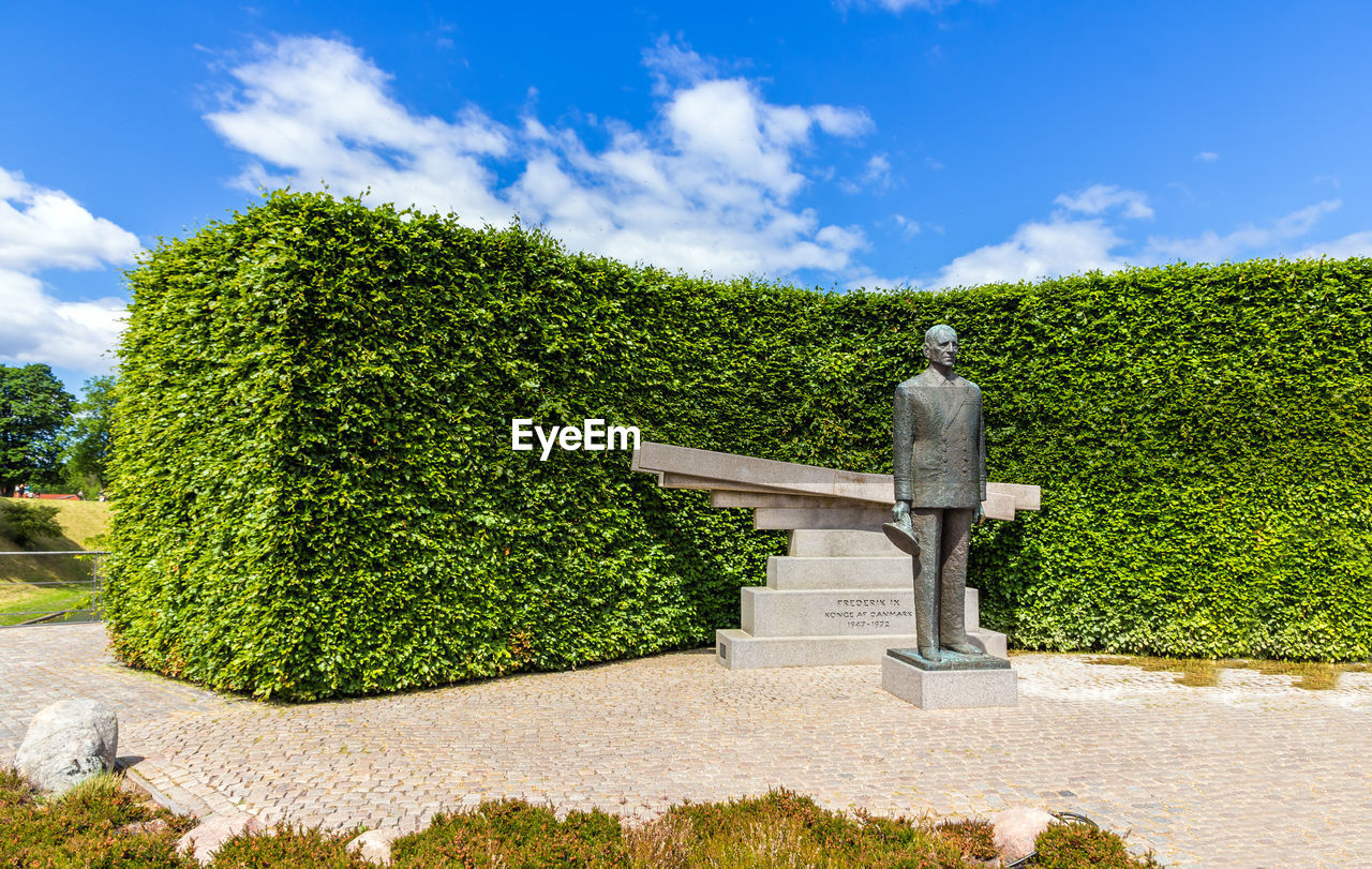 STATUE OF PLANT AGAINST SKY