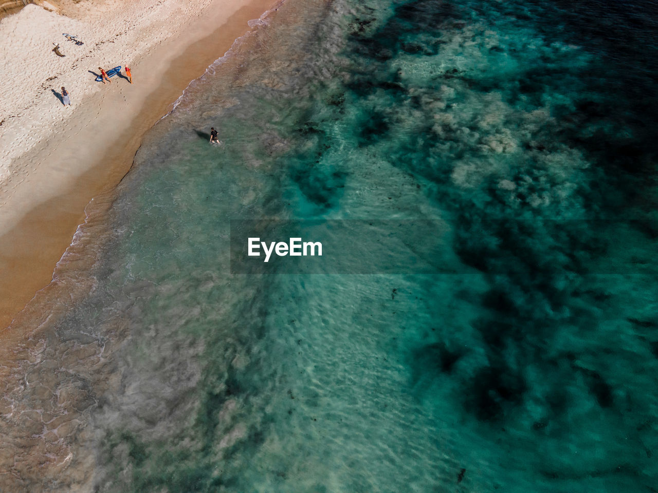 HIGH ANGLE VIEW OF PEOPLE AT BEACH