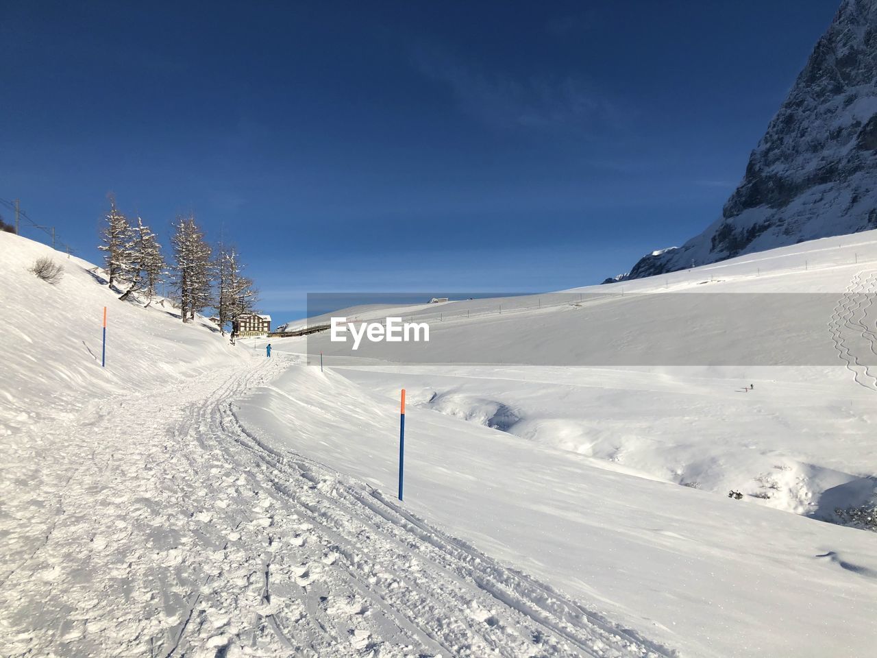 Scenic view of snow covered mountains against sky