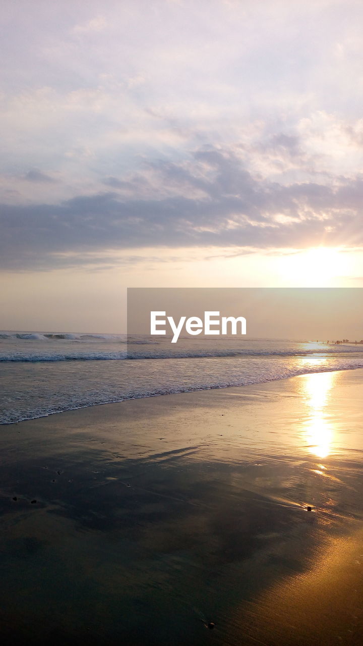 SCENIC VIEW OF BEACH DURING SUNSET