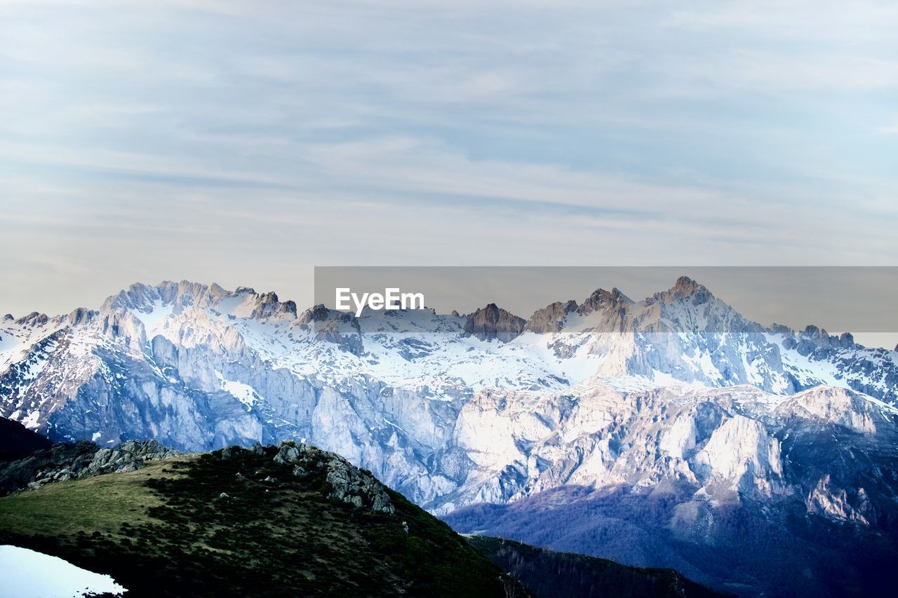 Scenic view of snowcapped mountains against sky