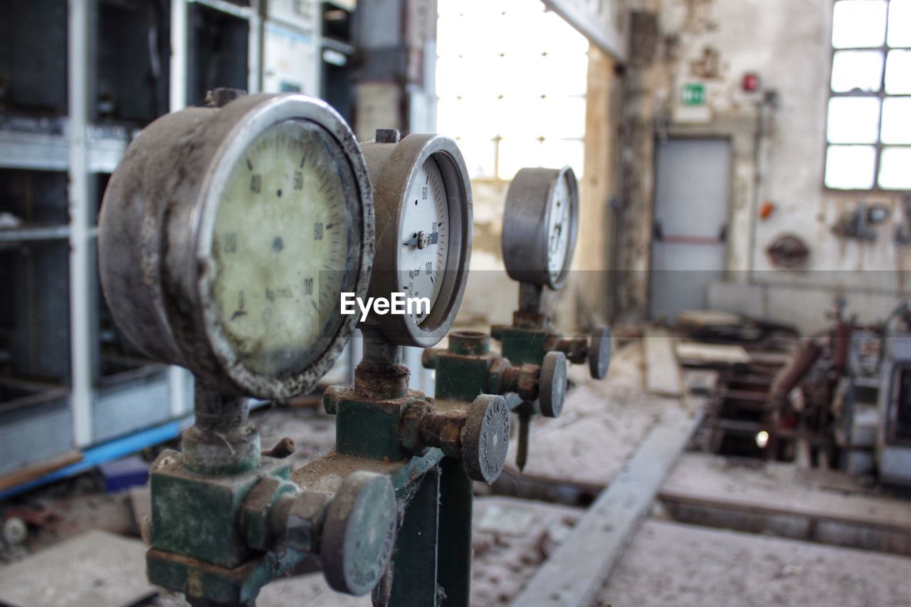 Close-up of rusty gauge in industry