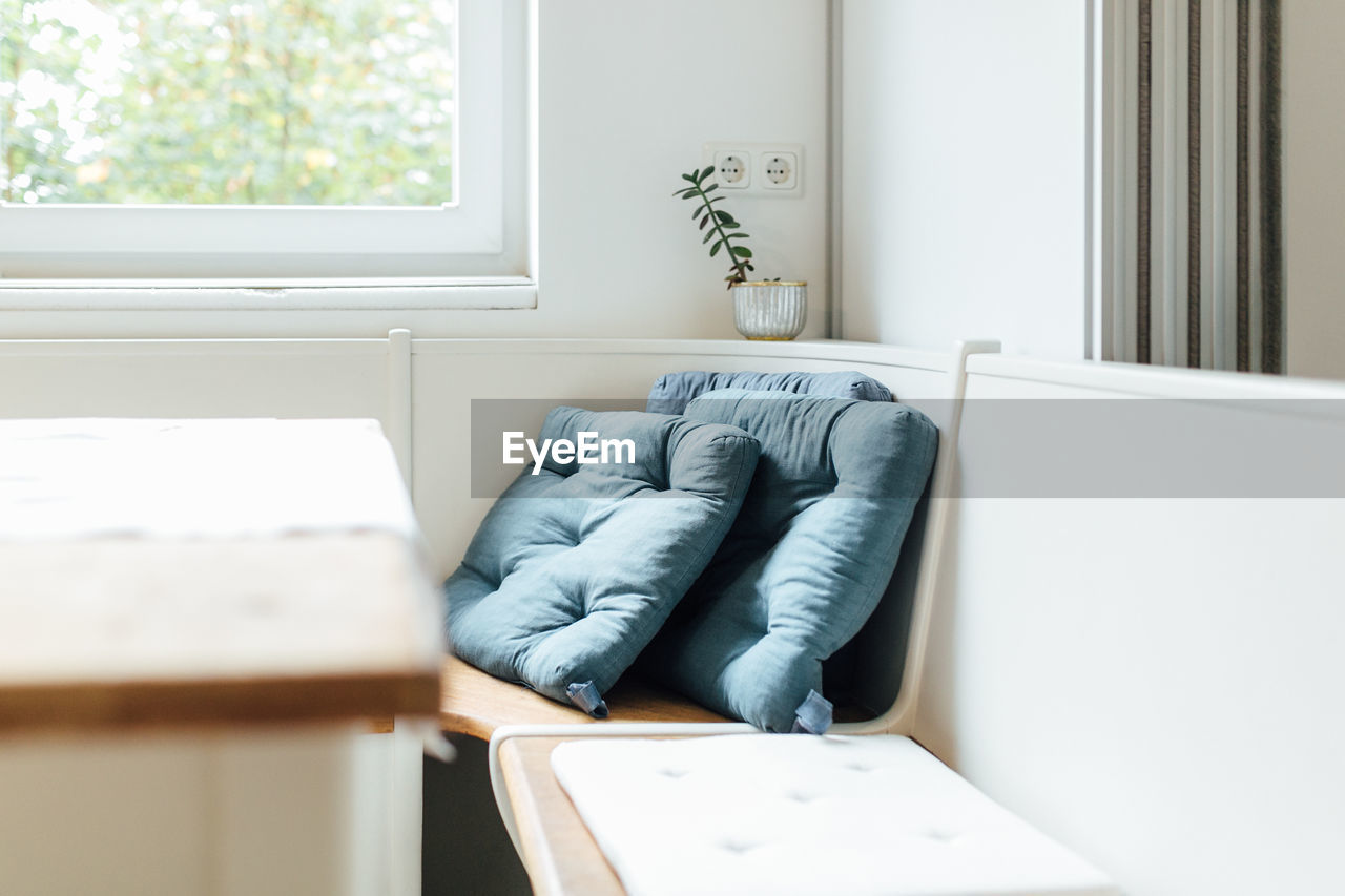 Cushions on window seat at home