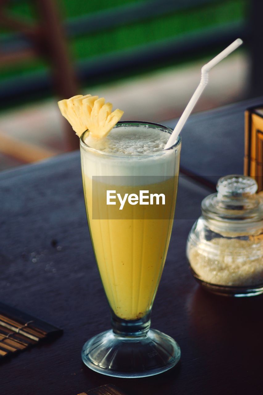 CLOSE-UP OF GLASS OF JUICE