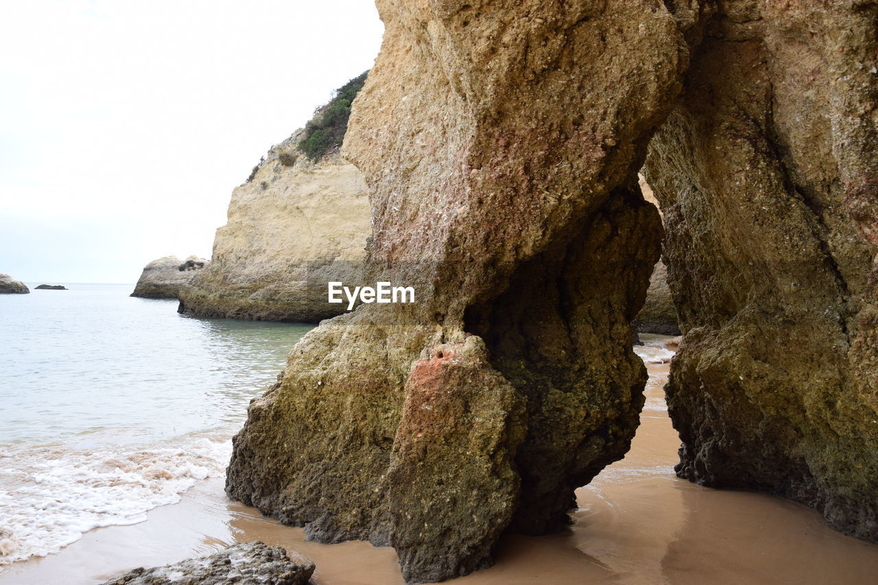 ROCK FORMATIONS ON BEACH